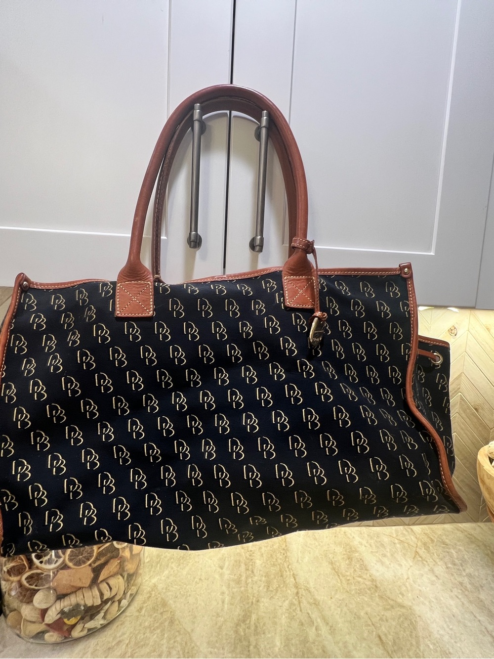 Dooney & Bourke Black Tote with Brown Leather Trim and Gold Monogram